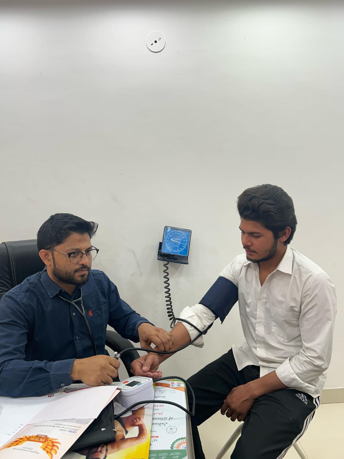 Blood pressure being measured in the consultation room