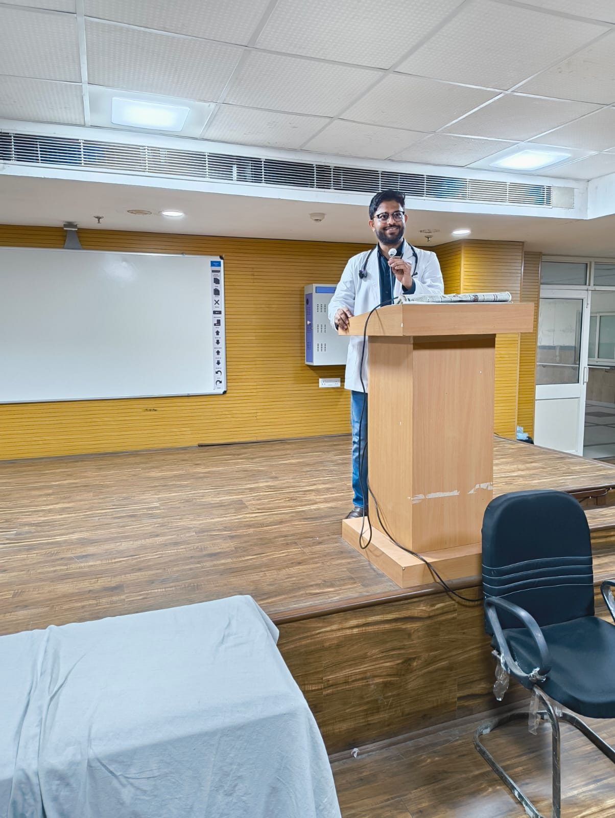Dr. Arif Khan speaking at a medical teaching session